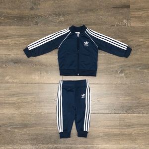 Never worn Adidas baby tracksuit set 6-9 months.
